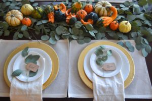 Thankgsiving tablescape with eucalyptus leaves, eucalyptus and pumpkin thanksgiving centerpiece, thanksgiving pumpkin table centerpiece