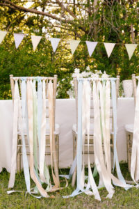 five ways to make chairs stand out at a party, ribbon back chairs, decorating party chairs