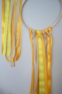 diy ribbon garland, embroidery hoop diy, easy ribbon party decor, yellow party decor, ribbon hoop garland tutorial