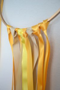 diy ribbon garland, embroidery hoop diy, easy ribbon party decor, yellow party decor, ribbon hoop garland tutorial