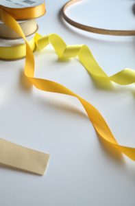 diy ribbon garland, embroidery hoop diy, easy ribbon party decor, yellow party decor, ribbon hoop garland tutorial