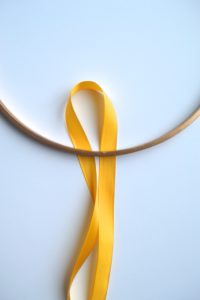 diy ribbon garland, embroidery hoop diy, easy ribbon party decor, yellow party decor, ribbon hoop garland tutorial